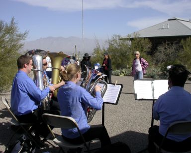The Arizona Tuba Quartet serenades walkers in honor of the state's centennial.